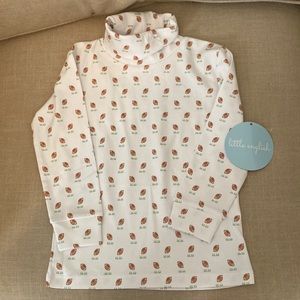 Adorable football turtleneck.